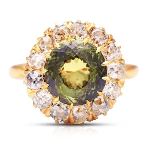 French, Belle Époque 5.06ct green-yellow sapphire and diamond engagement ring